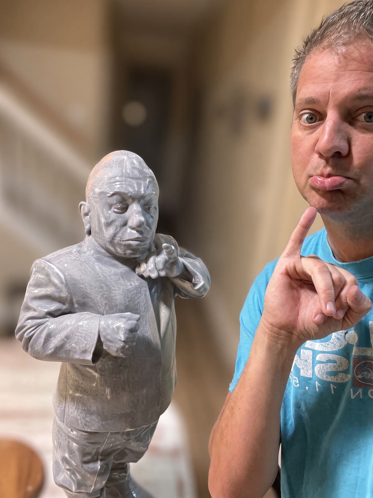 A grey primed character figurine
