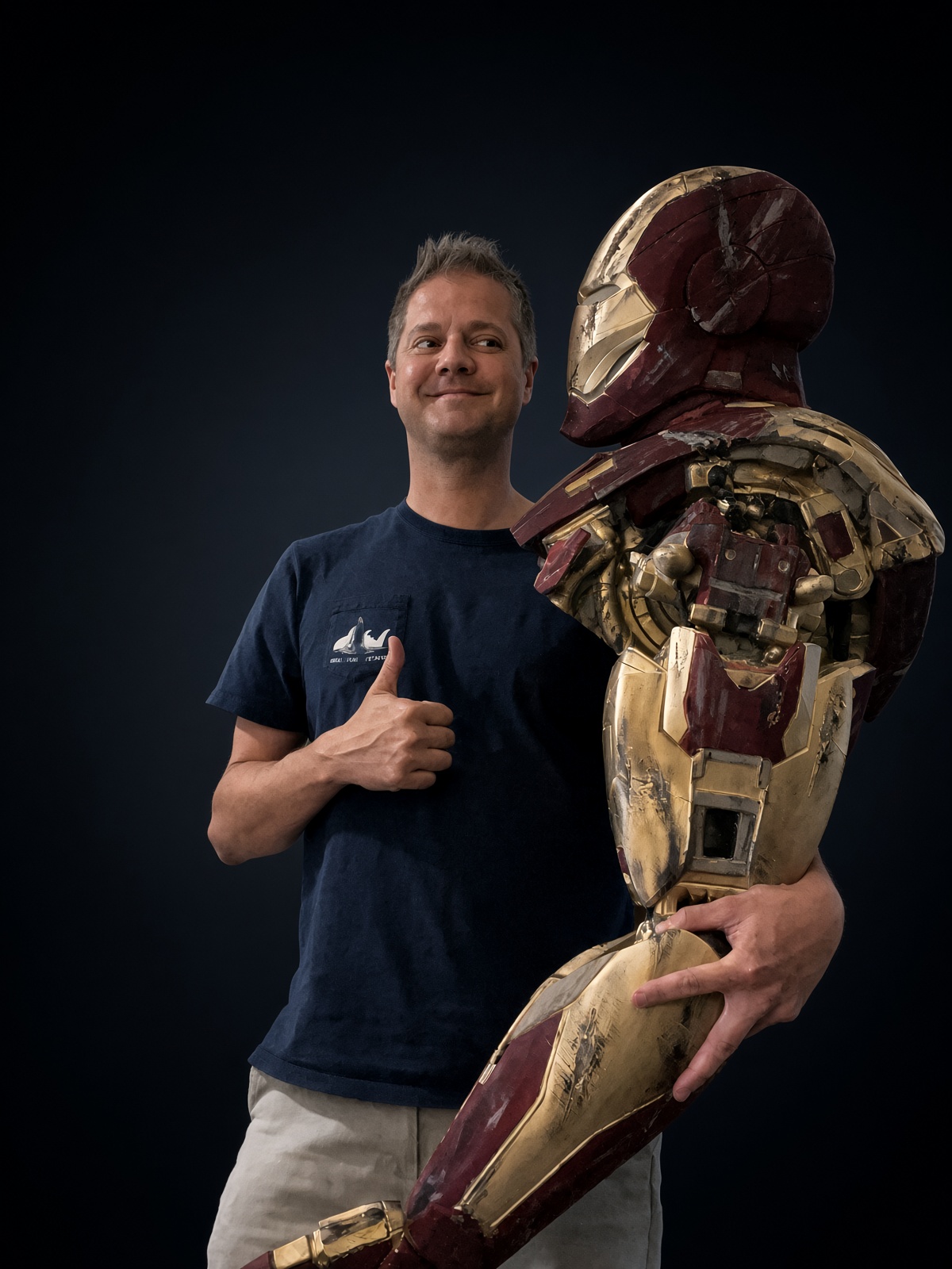 Matt Baribeau holding his hand-finished Iron Man prop